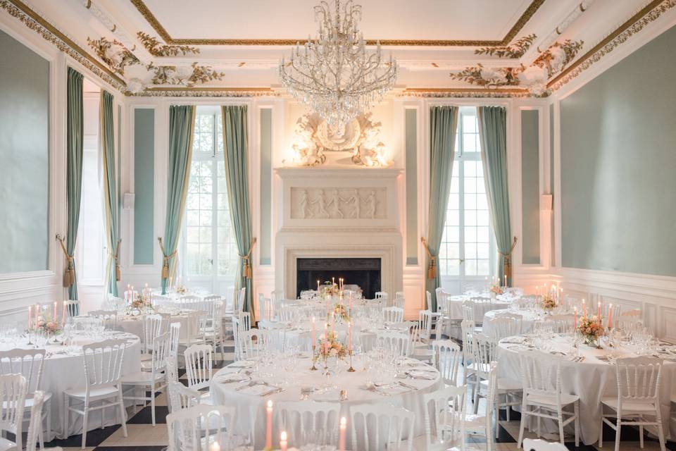 Round table setup at Château de Saint-Martin-du-Tertre, elegant and cozy.

