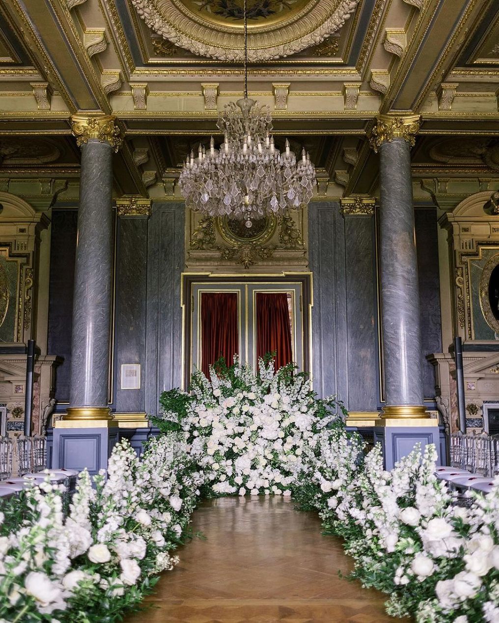 Indoor wedding ceremony at Château de Ferrières with sophisticated décor.
