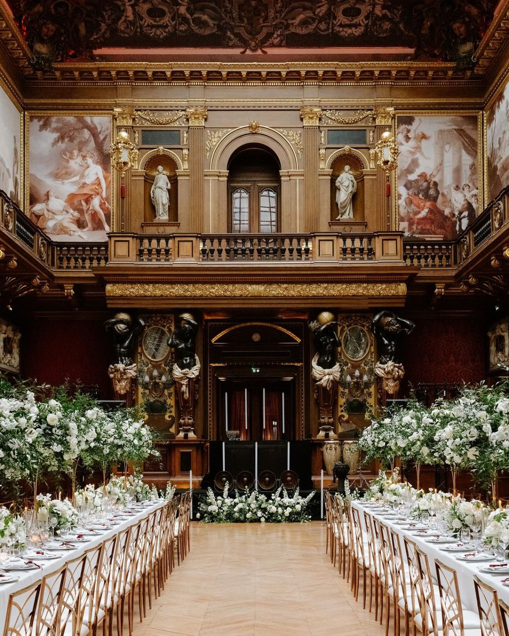 Wedding at Château de Ferrières: indoor banquet tables set with elegance.

