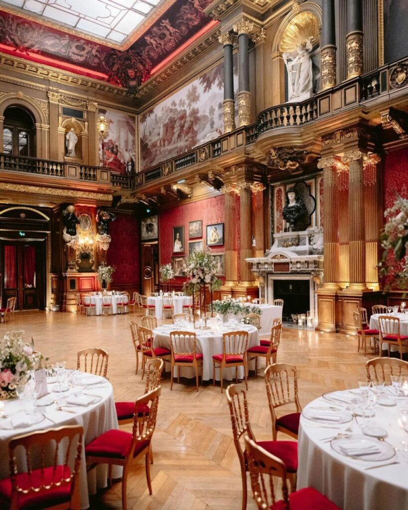Wedding at Château de Ferrières with elegant round table dinner inside.
